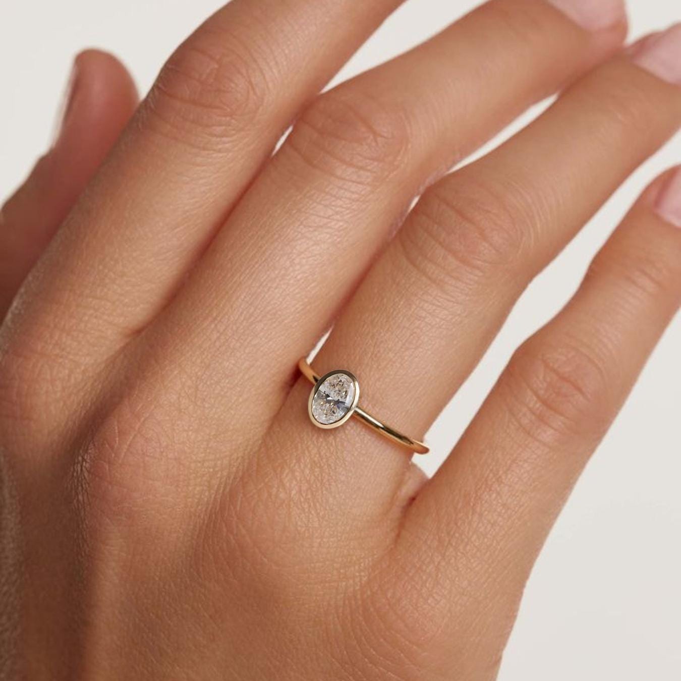 2 Carat IGI Certified Oval Cut Lab Grown Diamond Bezel Set Solitaire Engagement Ring 14K Yellow Gold