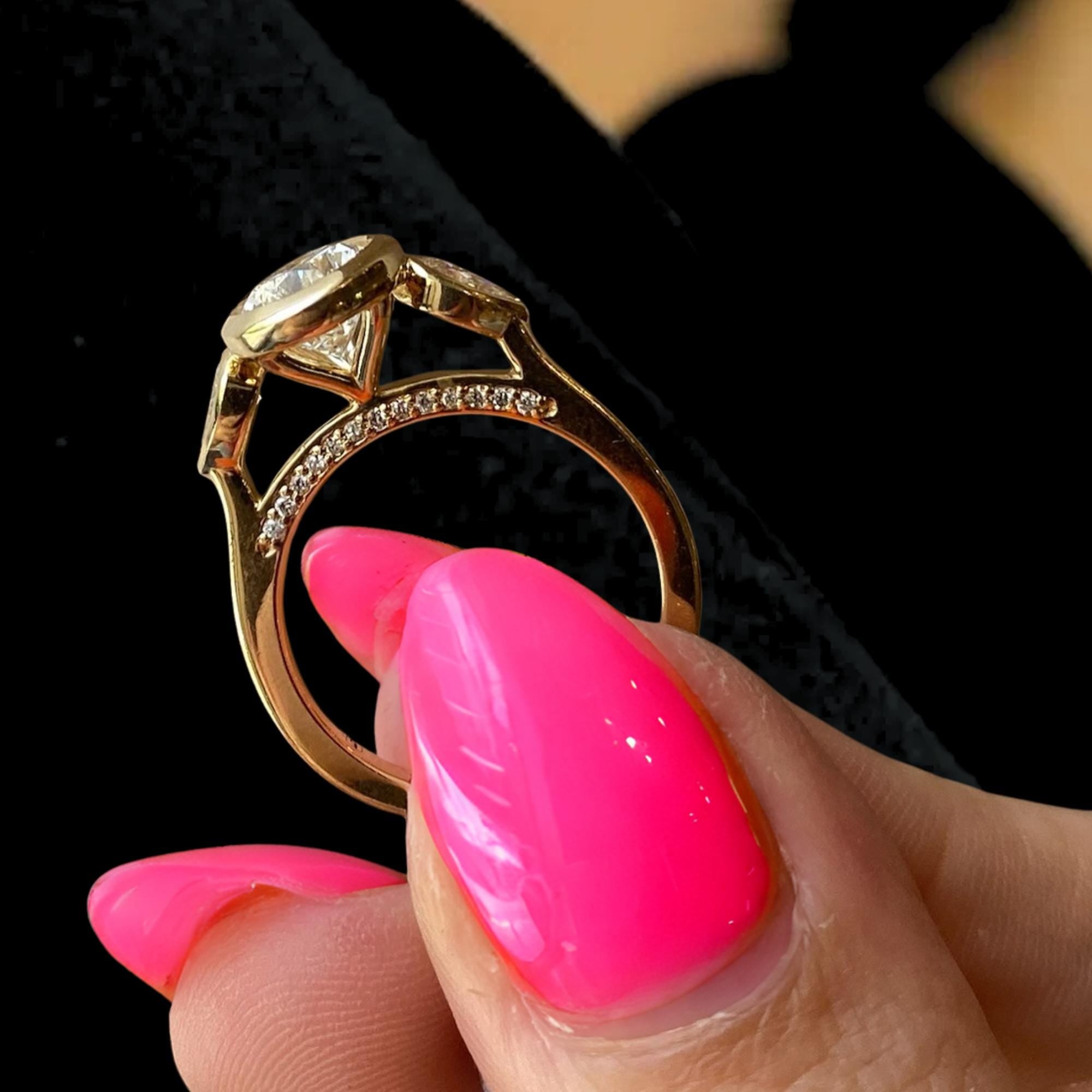 2 Carat Pear Cut Lab Created Diamond Bezel Set Three Stone Ring With Hidden Halo