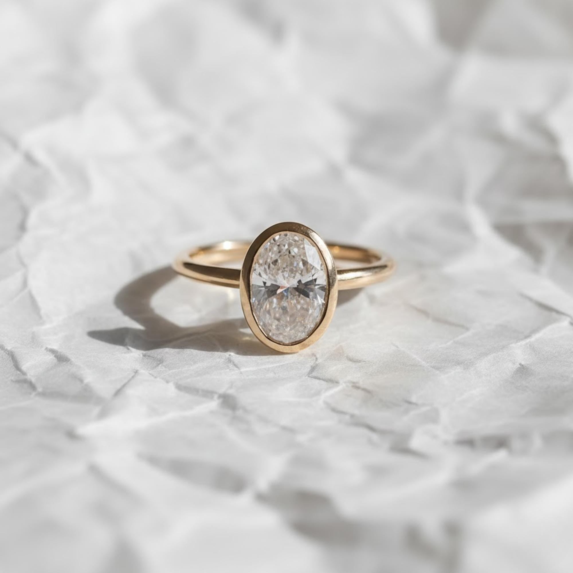 2 Carat IGI Certified Oval Cut Lab Grown Diamond Bezel Set Solitaire Engagement Ring 14K Yellow Gold